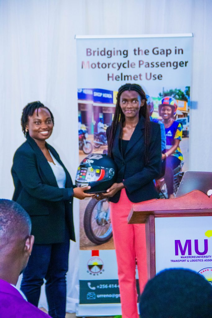 Our project lead handing over a helmet to student participant.